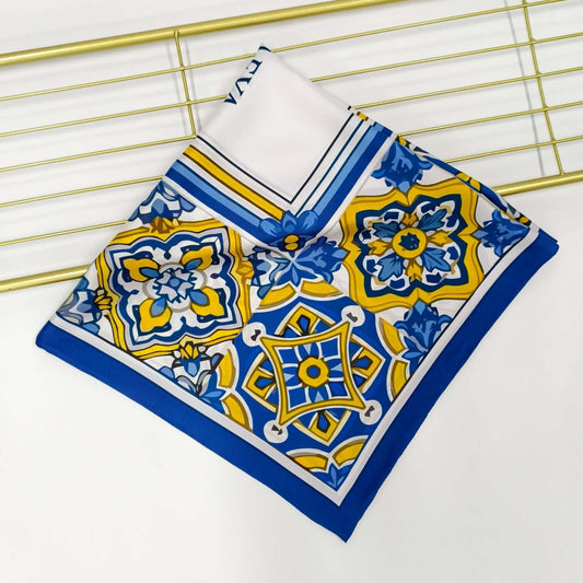 Colorful azulejos design featuring intricate patterns in blue and yellow with 'ALVAEYA' in the center.