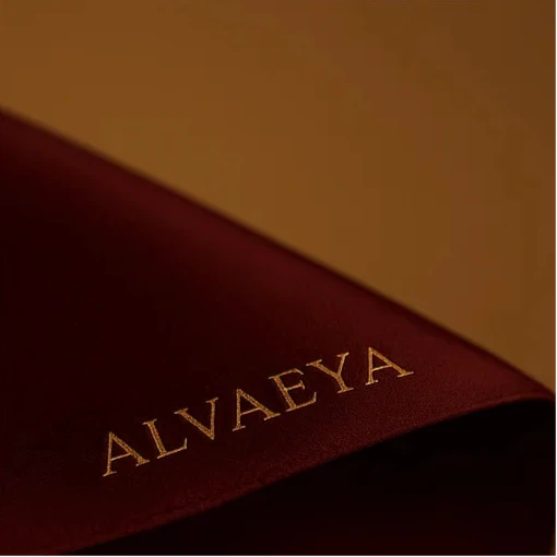 Close-up of a brown product with 'ALVAEYA' embroidered on it.